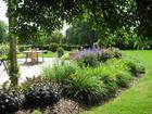 Main terrace enclosed by planting of Hemerocallis, Sedum and Nepeta